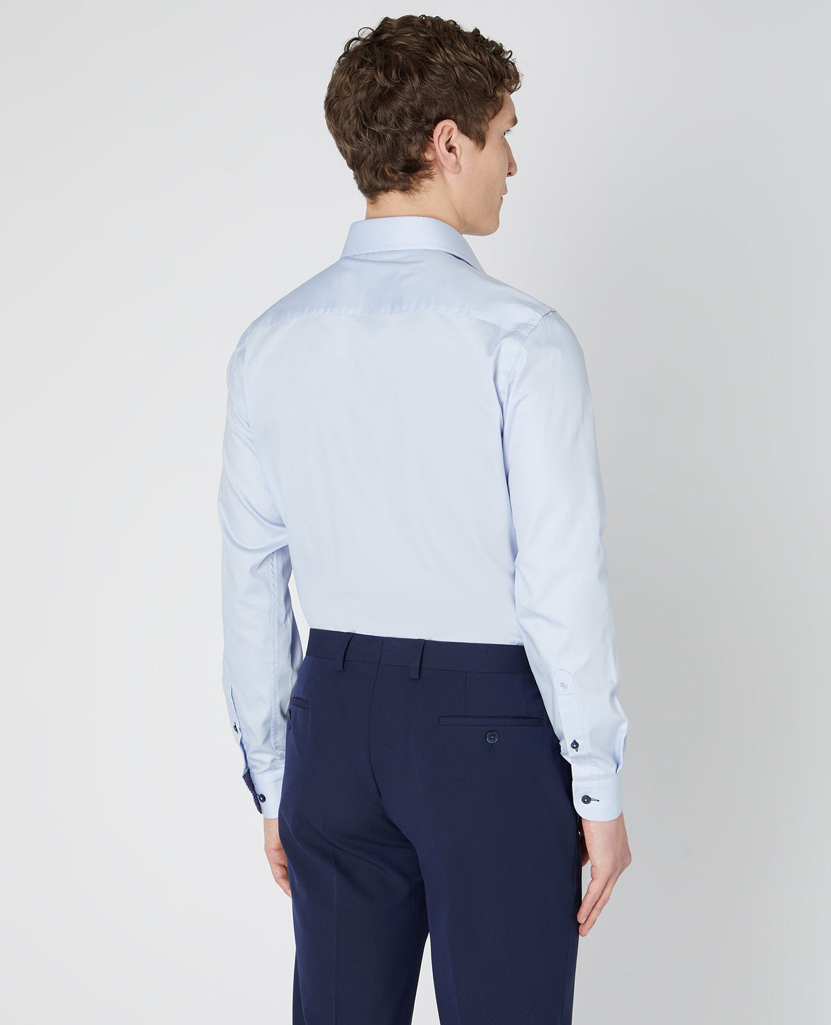 Man wearing a blue Tapered Fit Cotton-Blend Satin Shirt