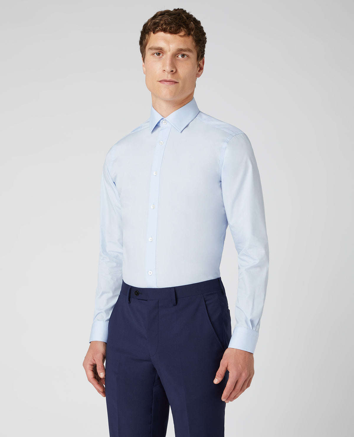 Man wearing a blue Tapered Fit Cotton-Blend Shirt