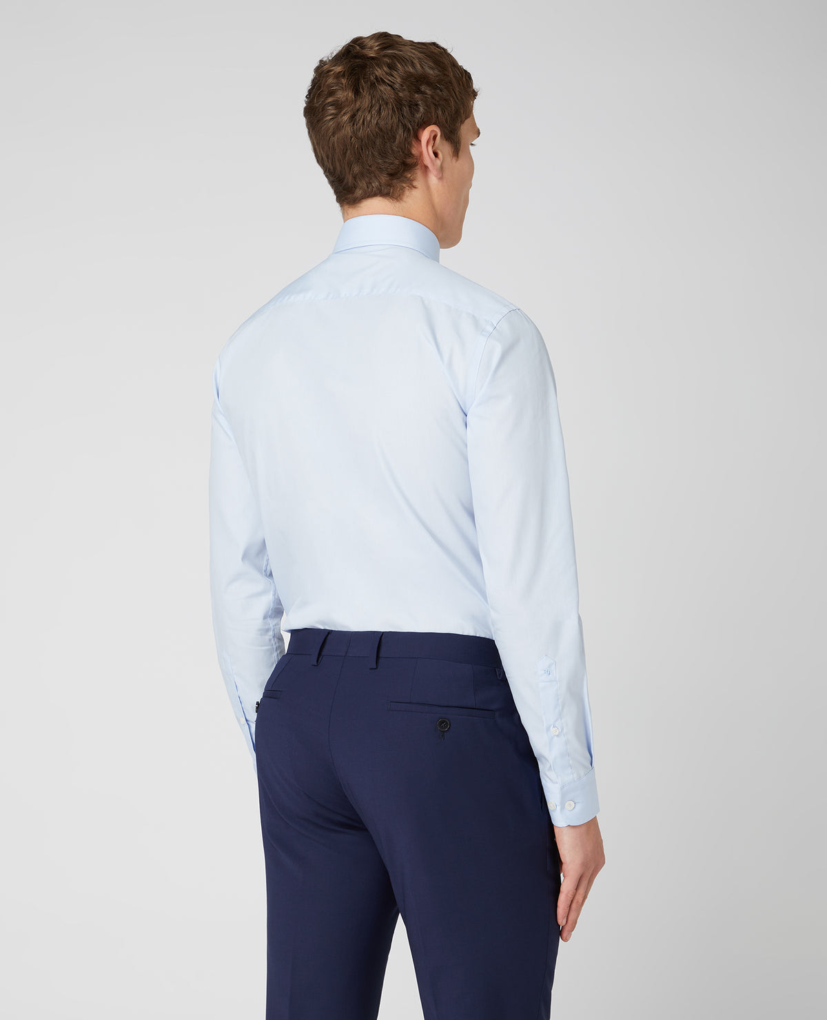 Man wearing a blue Tapered Fit Cotton-Blend Shirt