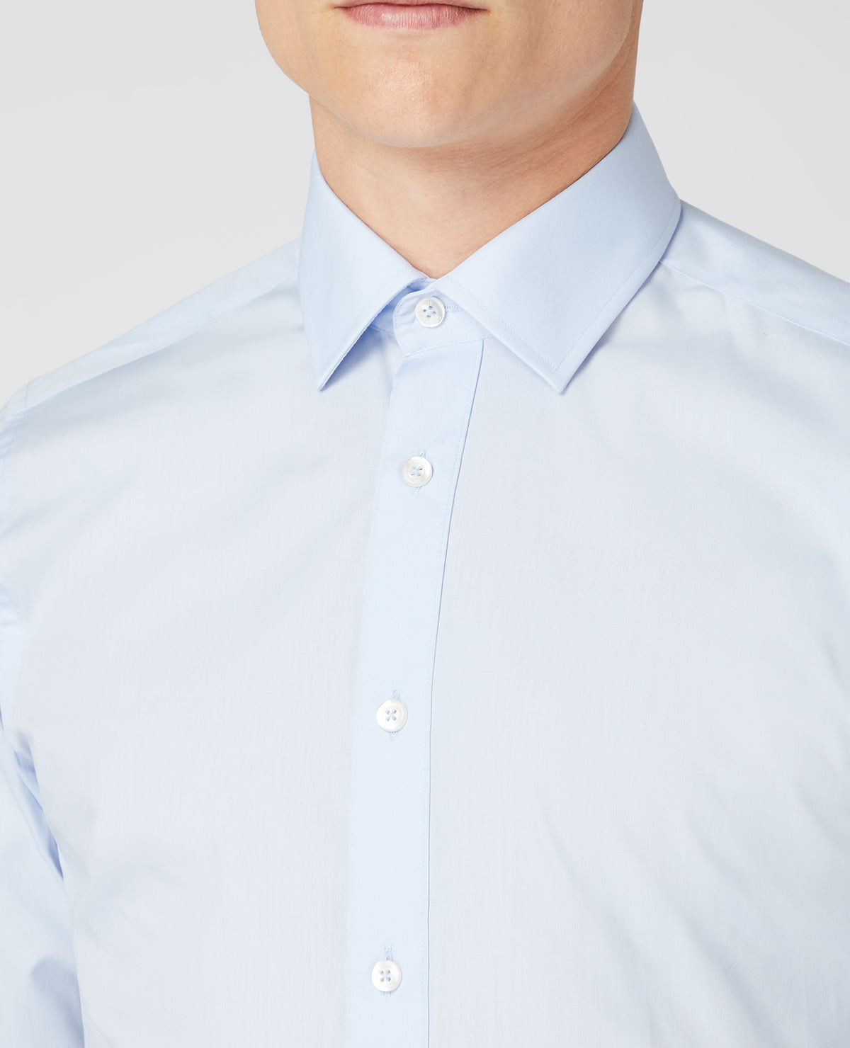 Man wearing a blue Tapered Fit Cotton-Blend Shirt