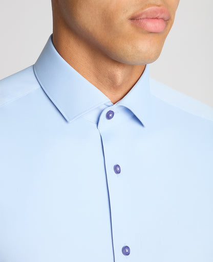 Man wearing a blue Slim Fit Cotton Stretch Shirt