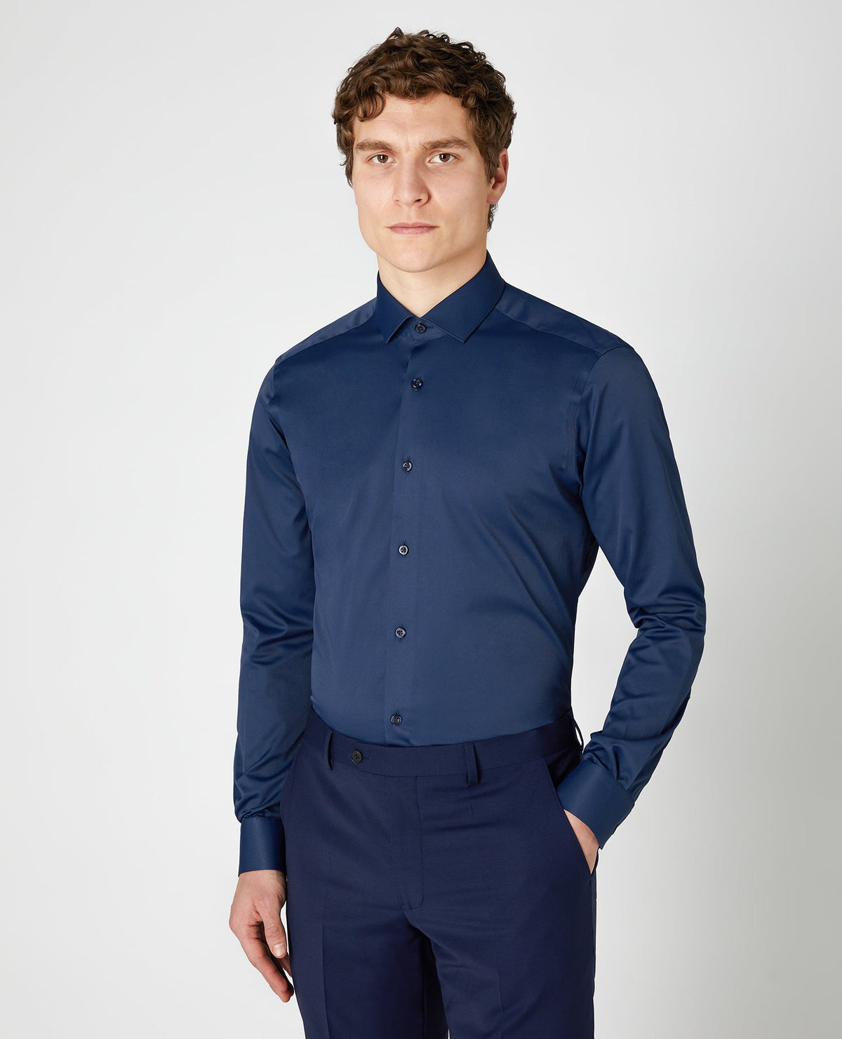 Man wearing a navy Slim Fit Cotton Stretch Shirt