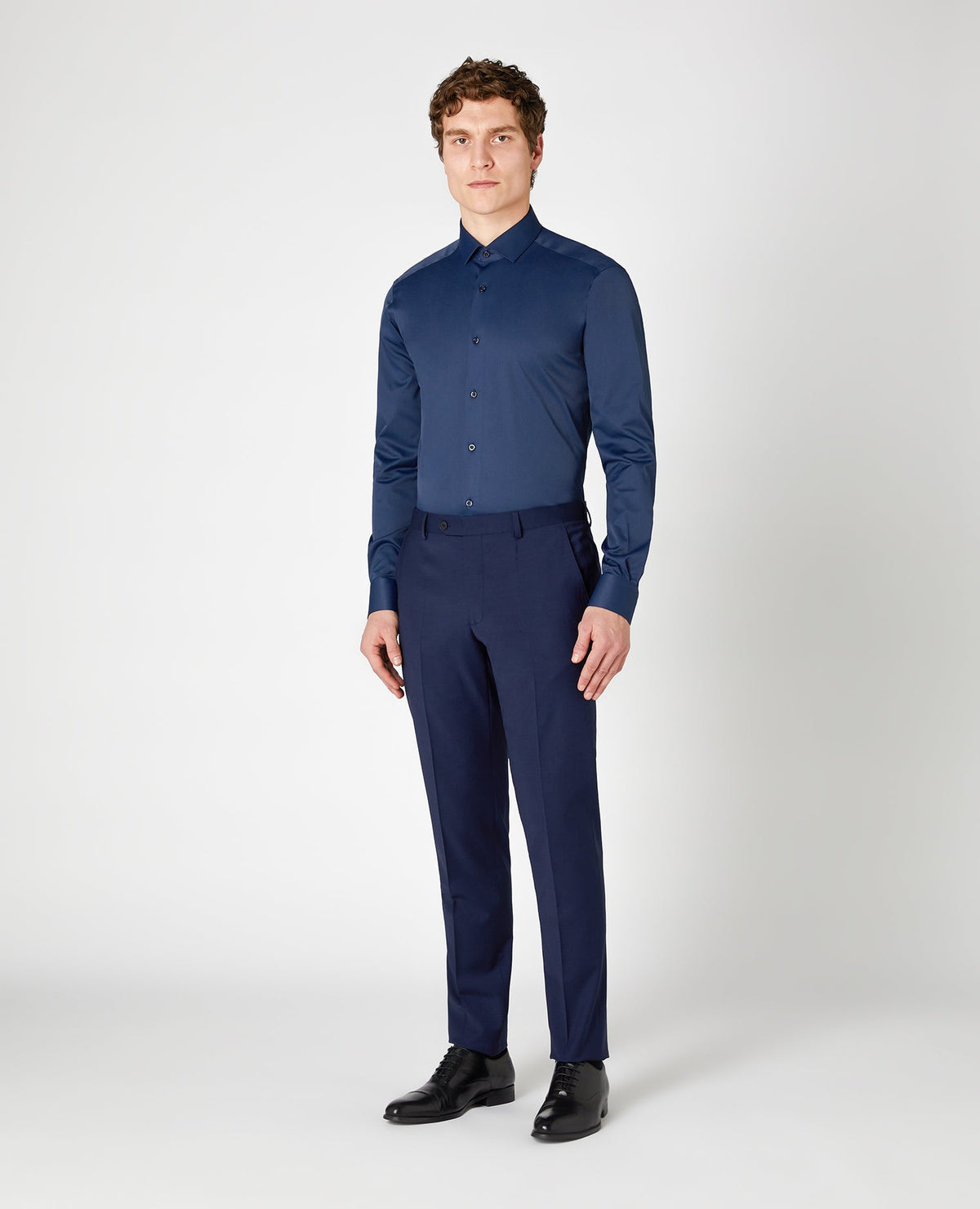 Man wearing a navy Slim Fit Cotton Stretch Shirt