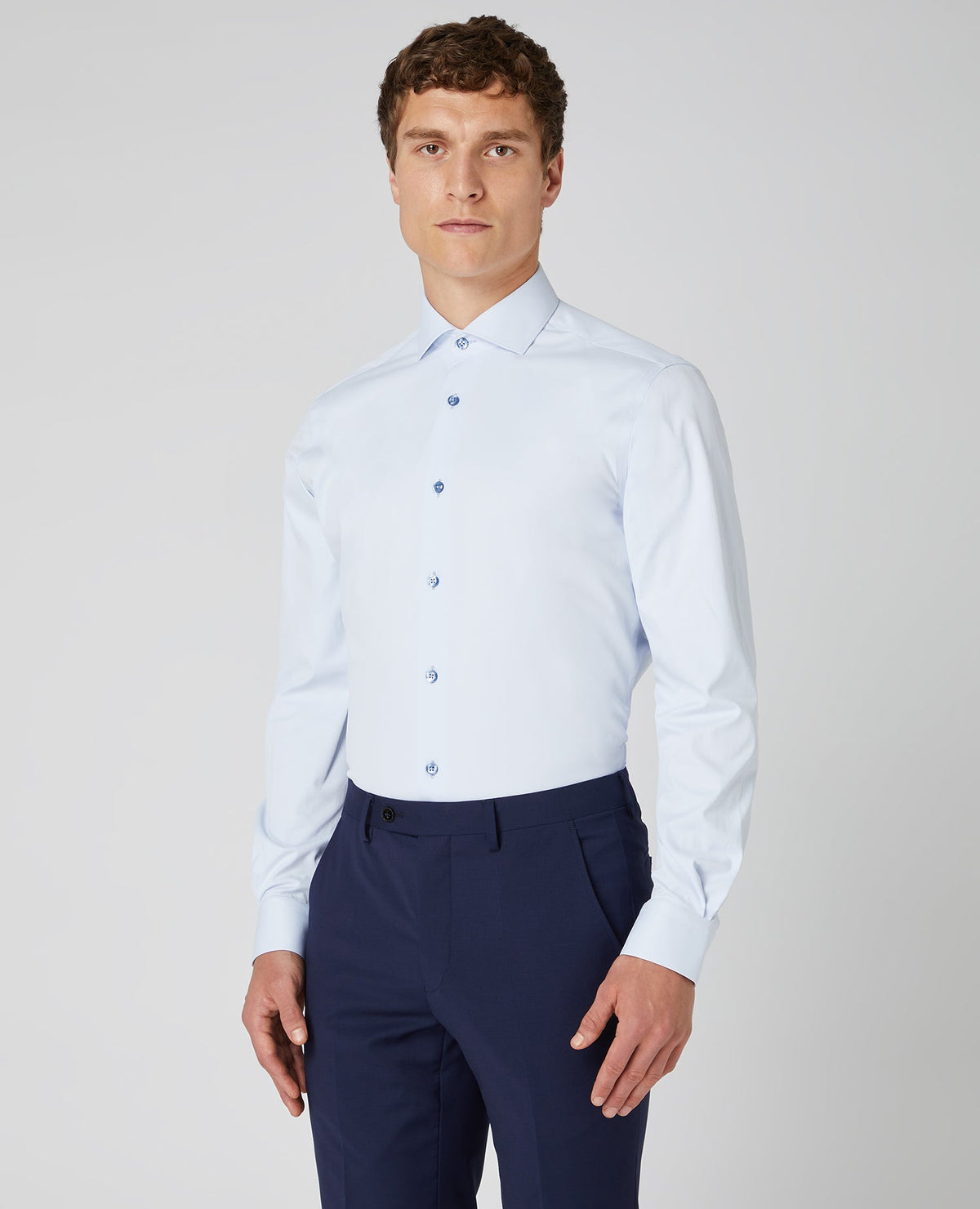Man wearing a blue Tapered Fit Cotton Stretch Shirt