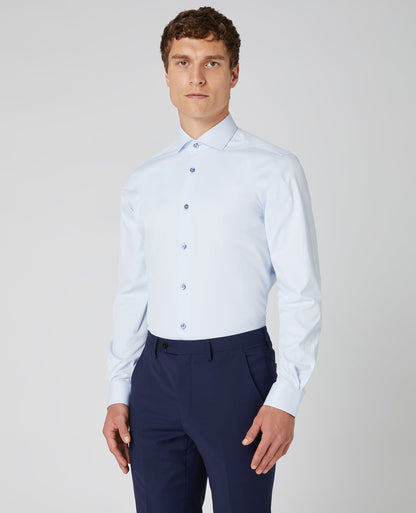 Man wearing a blue Tapered Fit Cotton Stretch Shirt