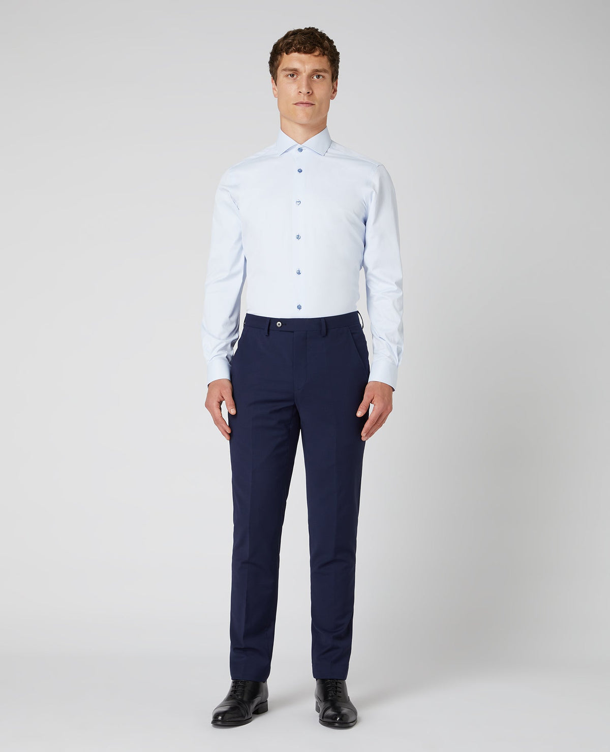 Man wearing a blue Tapered Fit Cotton Stretch Shirt