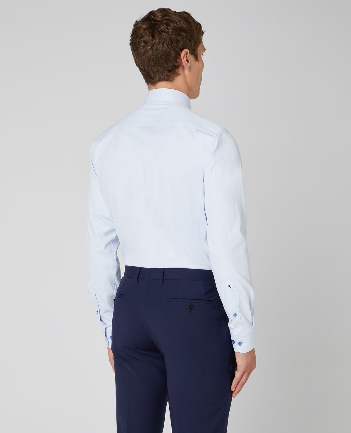 Man wearing a blue Tapered Fit Cotton Stretch Shirt