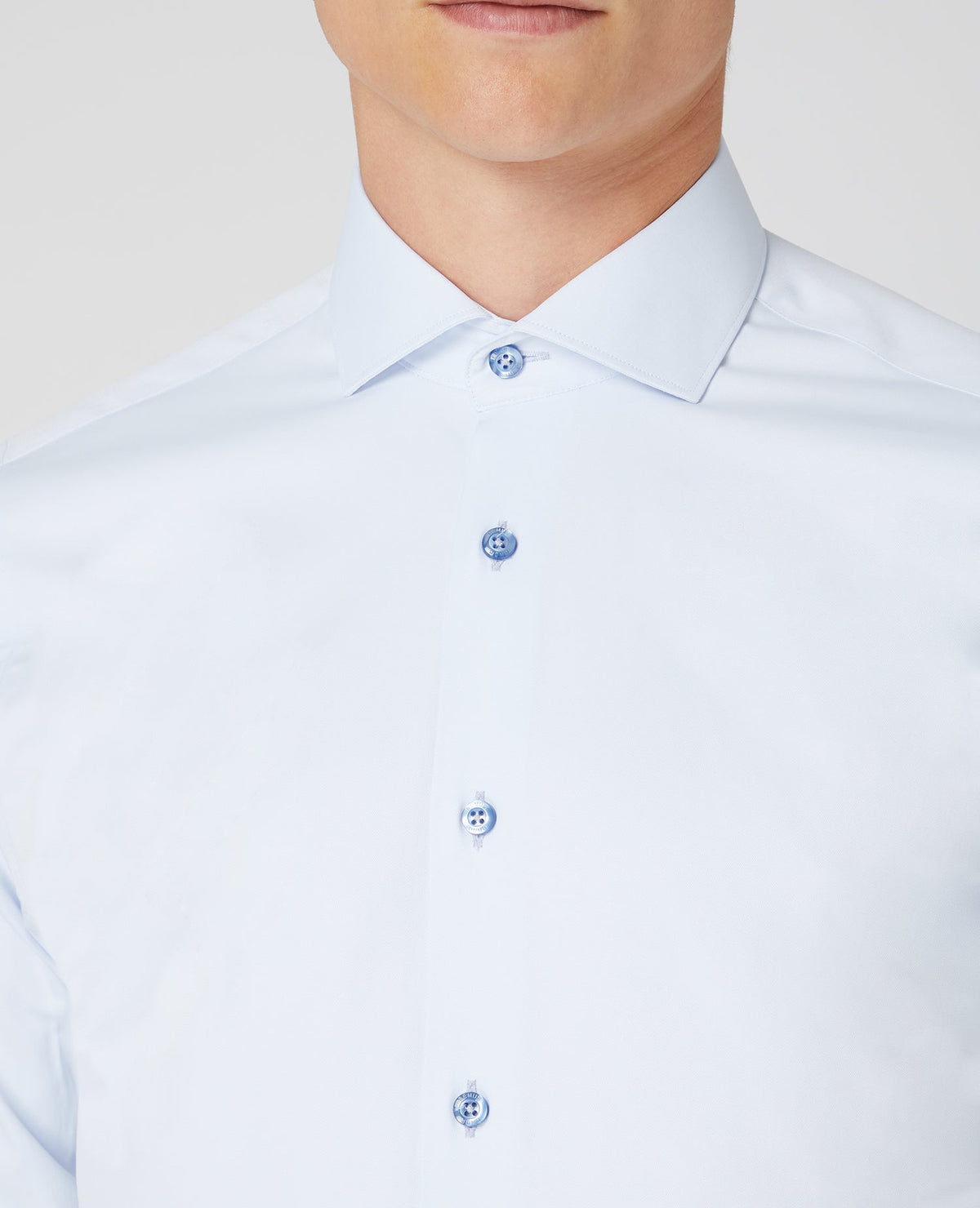Man wearing a blue Tapered Fit Cotton Stretch Shirt