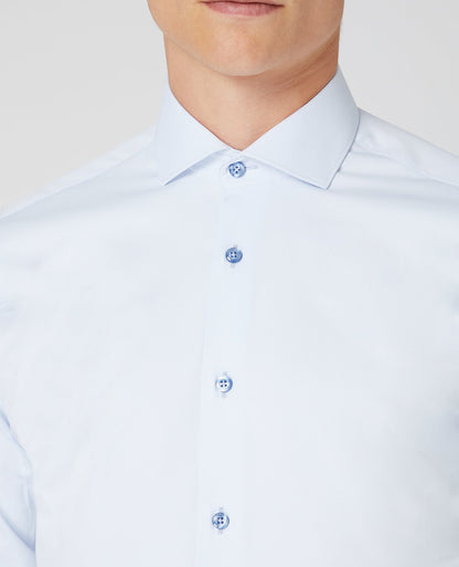 Man wearing a blue Tapered Fit Cotton Stretch Shirt