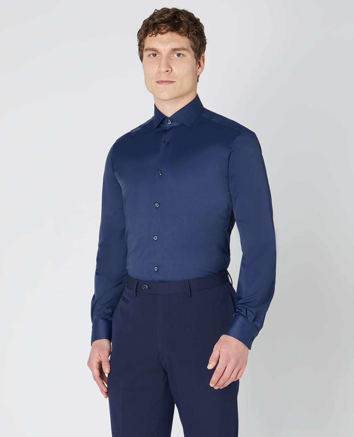 Man wearing a navy Tapered Fit Cotton Stretch Shirt