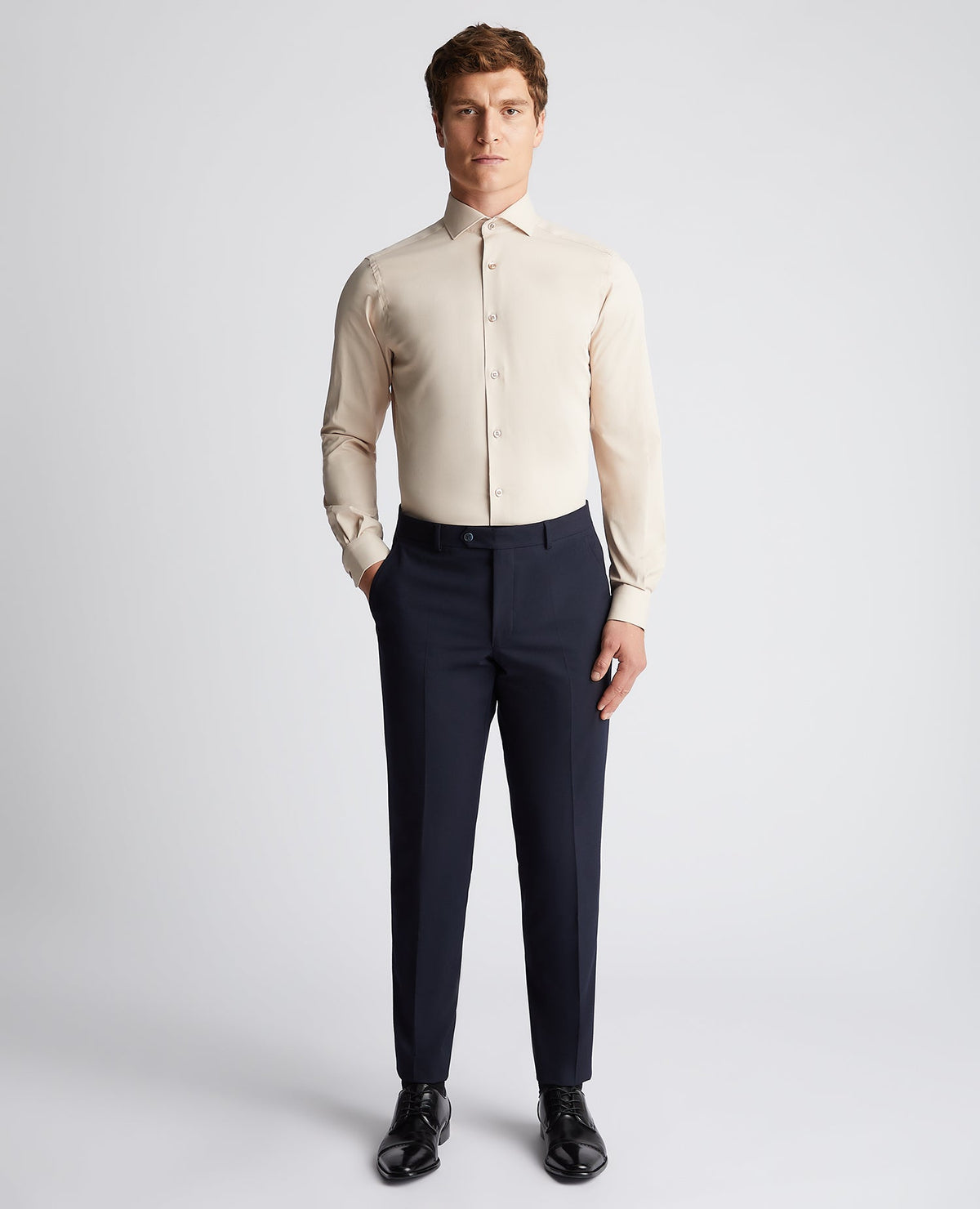 Man wearing a sand Tapered Fit Cotton Stretch Shirt