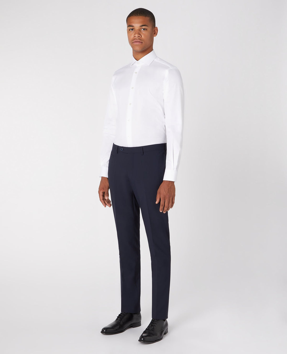 Man wearing a white Tapered Fit Cotton Shirt