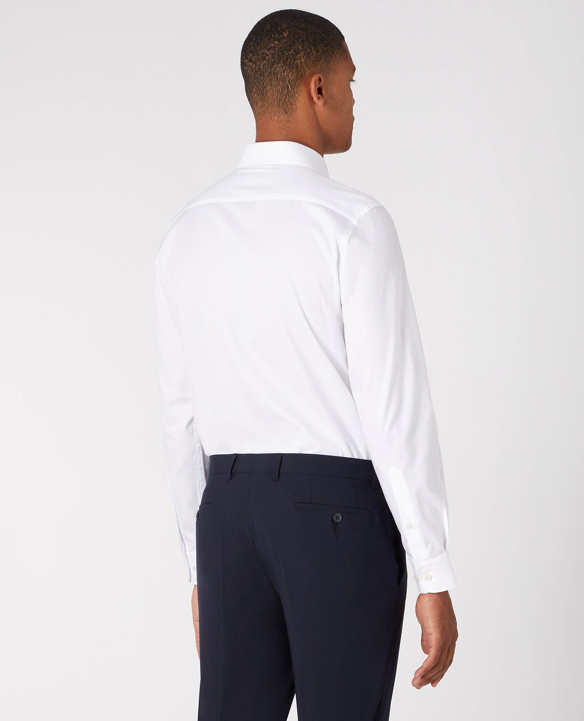 Man wearing a white Tapered Fit Cotton Shirt
