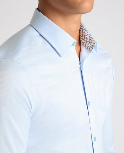 Man wearing a blue Slim Fit Cotton Stretch Jacquard Shirt