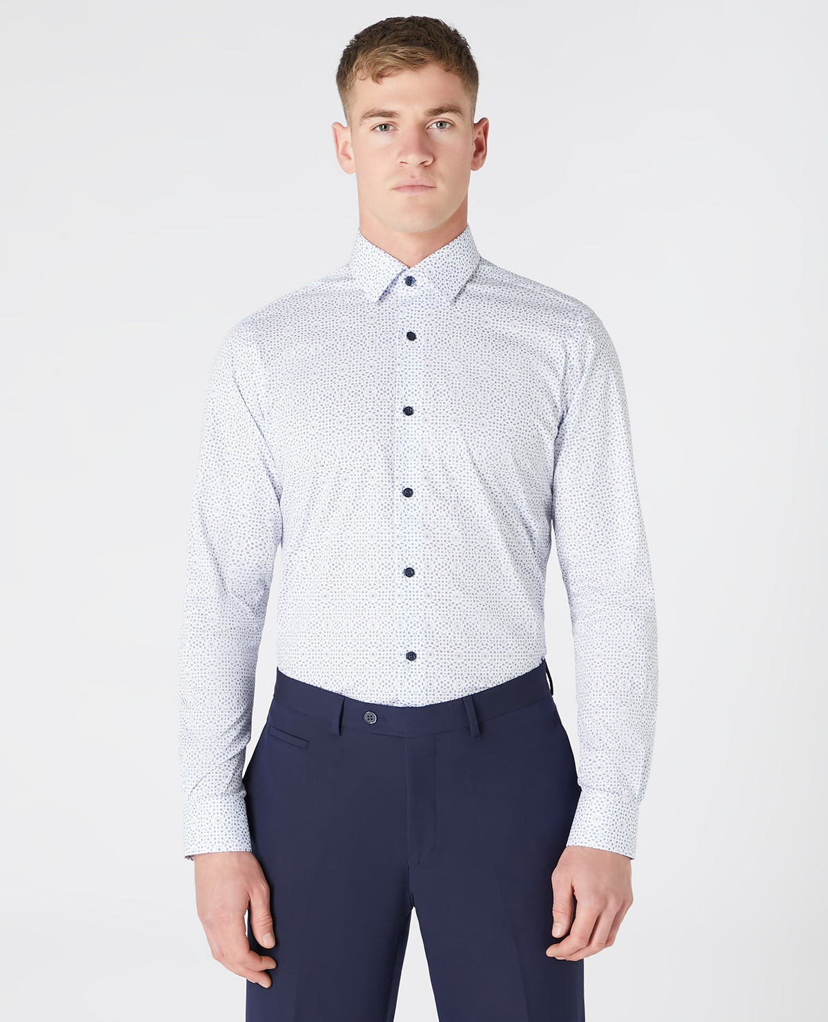 Man wearing a navy Tapered Fit Print Cotton Shirt