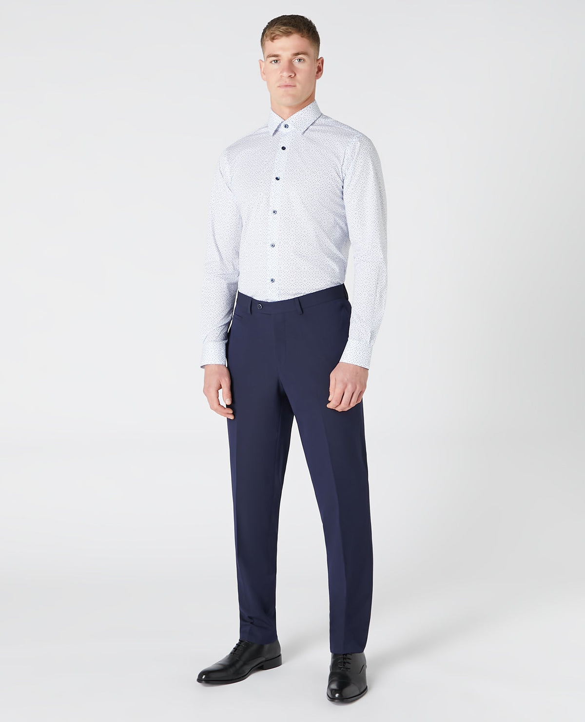 Man wearing a navy Tapered Fit Print Cotton Shirt