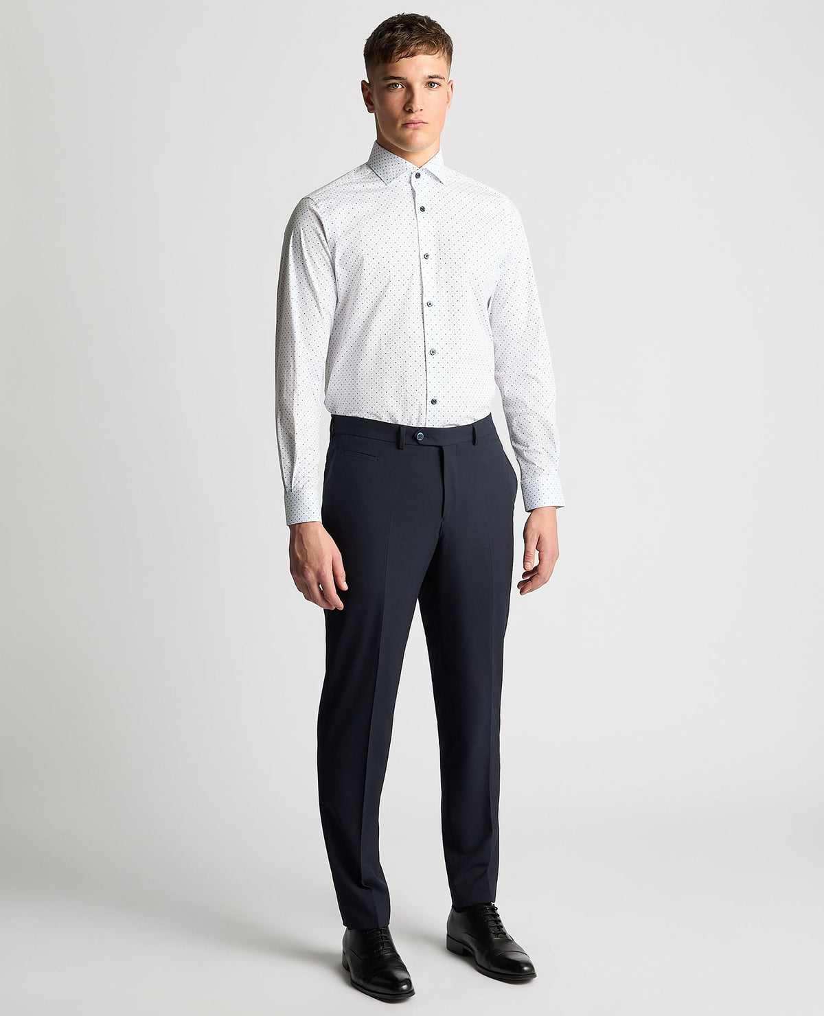 Man wearing a navy Tapered Fit Print Cotton Stretch Shirt