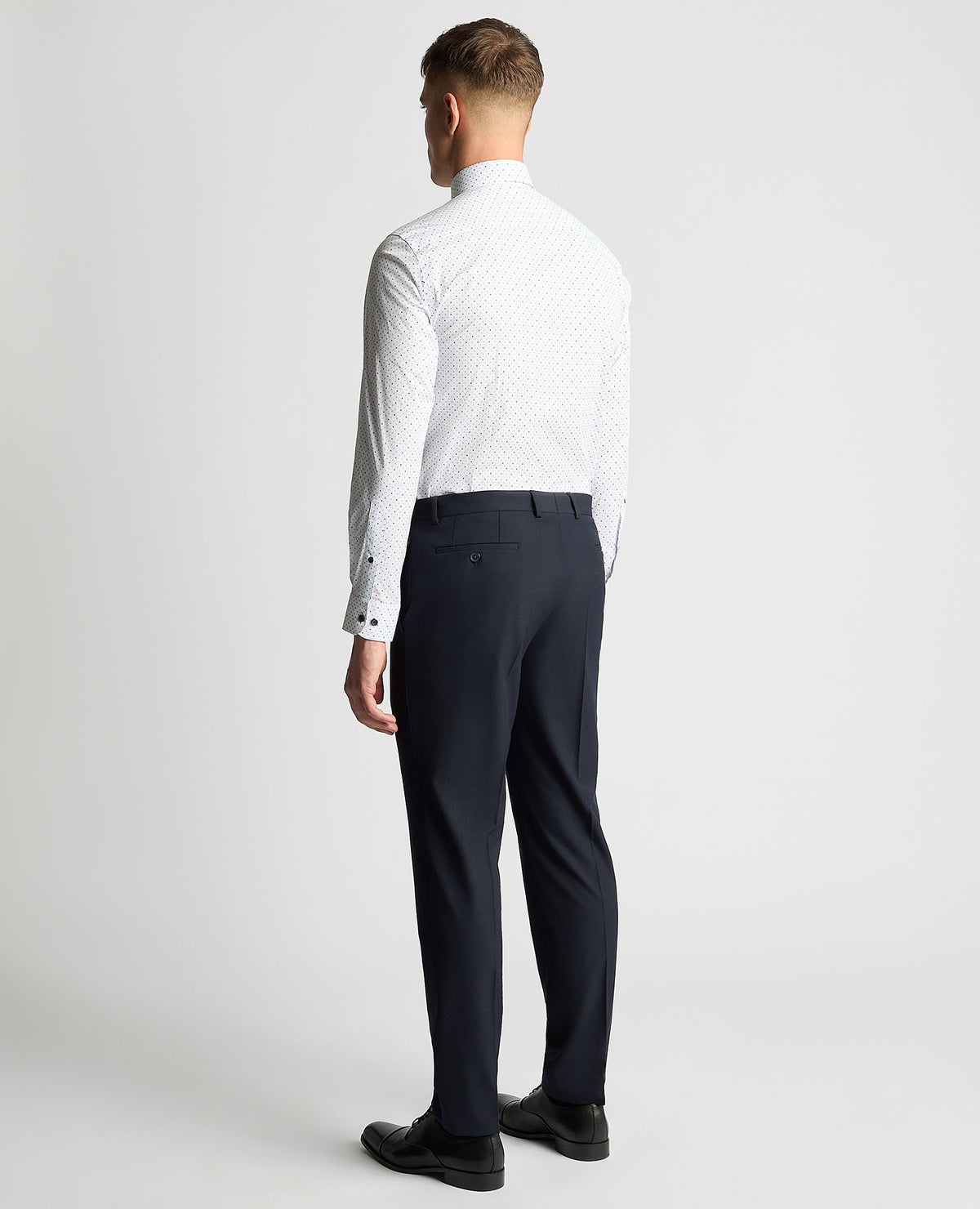 Man wearing a navy Tapered Fit Print Cotton Stretch Shirt