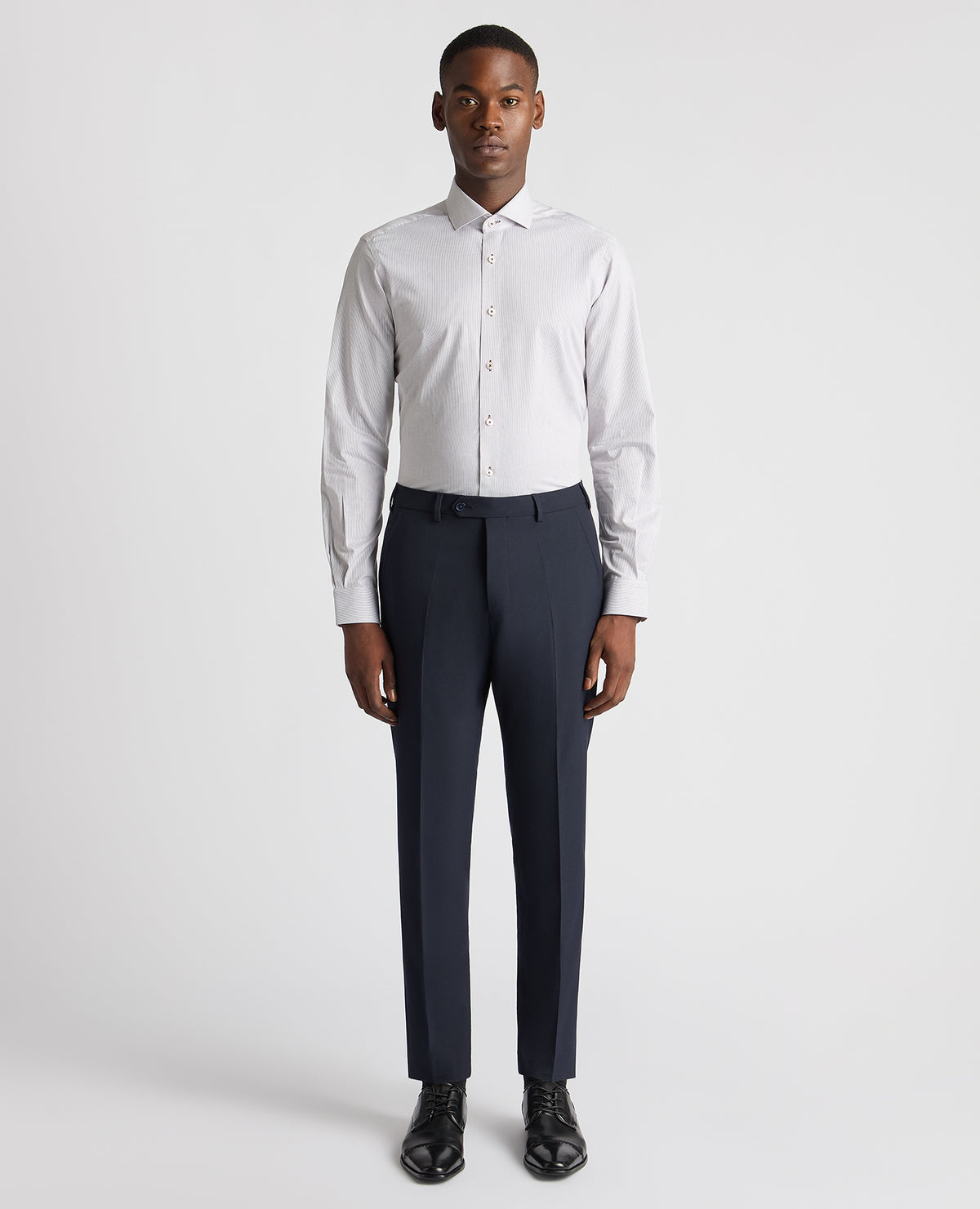 Man wearing a brown Tapered Fit Cotton Stretch Pinstripe Shirt
