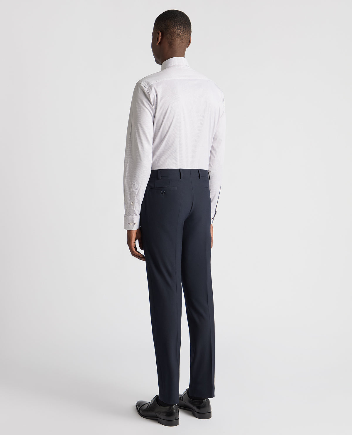 Man wearing a brown Tapered Fit Cotton Stretch Pinstripe Shirt