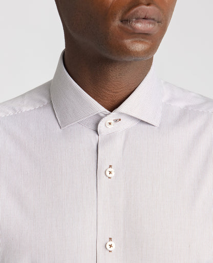 Man wearing a brown Tapered Fit Cotton Stretch Pinstripe Shirt