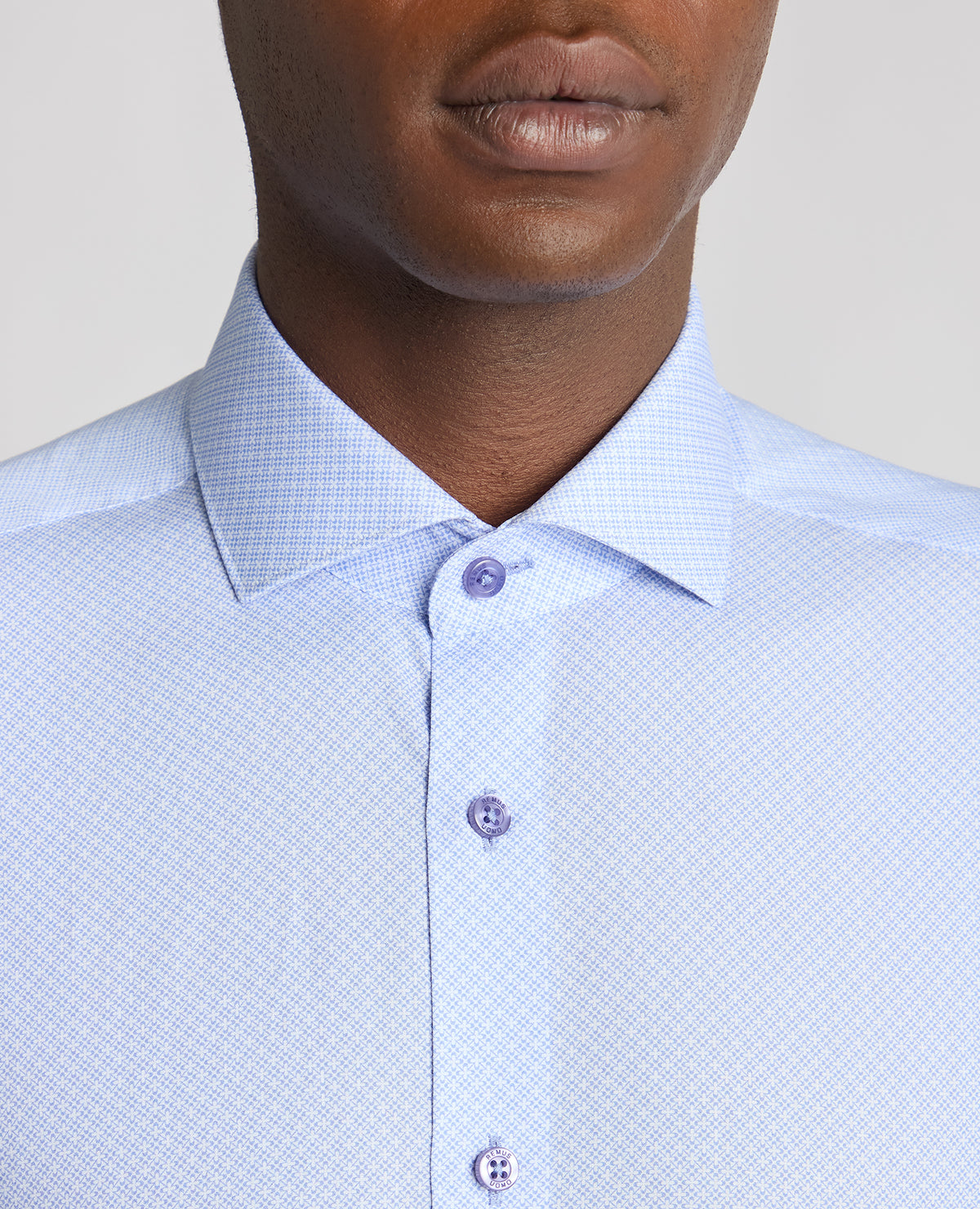 Man wearing a blue Tapered Fit Cotton Printed Shirt