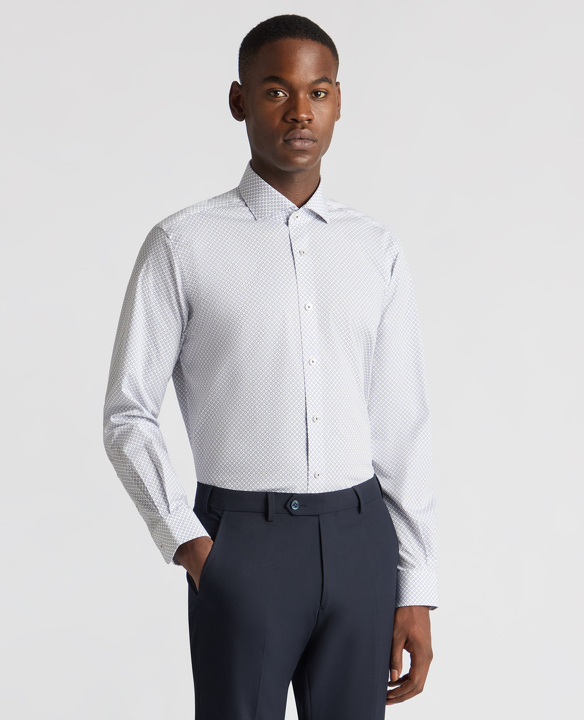 Man wearing a navy Tapered Fit Cotton Stretch Printed Shirt