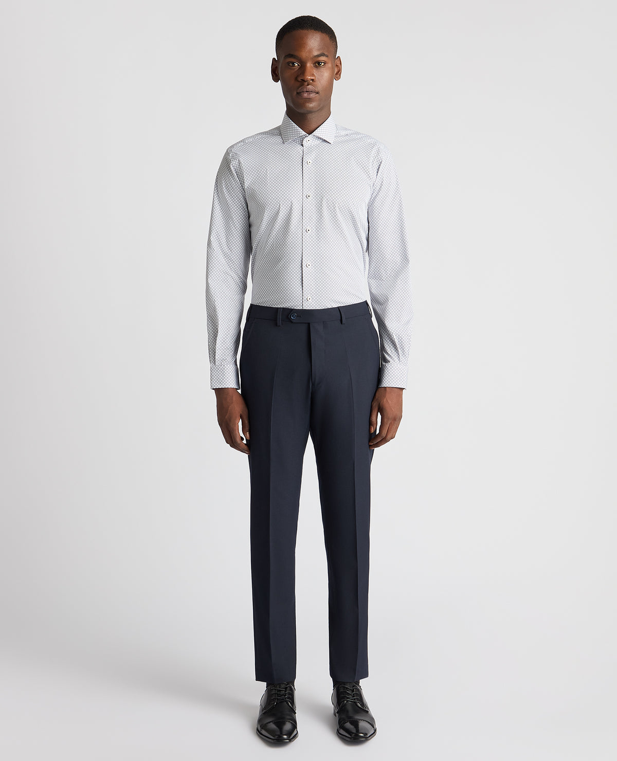 Man wearing a navy Tapered Fit Cotton Stretch Printed Shirt