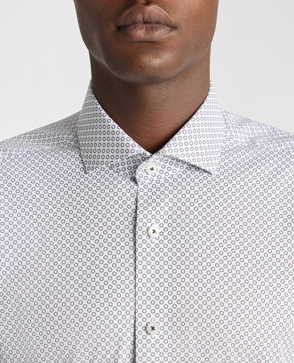 Man wearing a navy Tapered Fit Cotton Stretch Printed Shirt