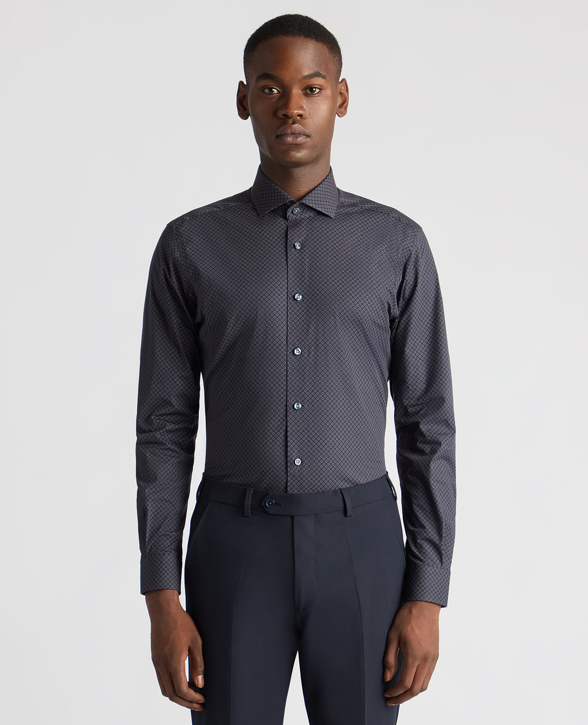 Man wearing a navy Tapered Fit Cotton Stretch Printed Shirt