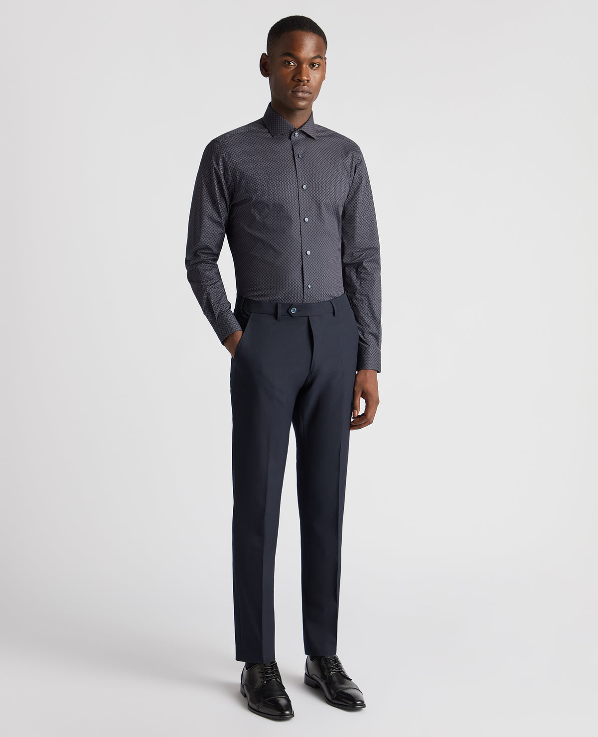 Man wearing a navy Tapered Fit Cotton Stretch Printed Shirt