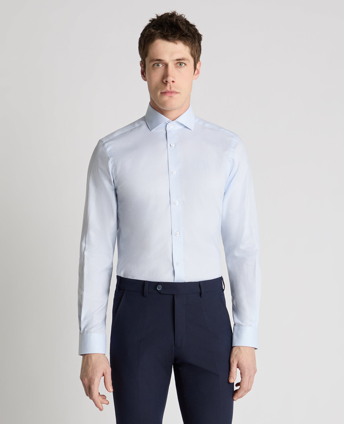 Man wearing a blue formal shirt