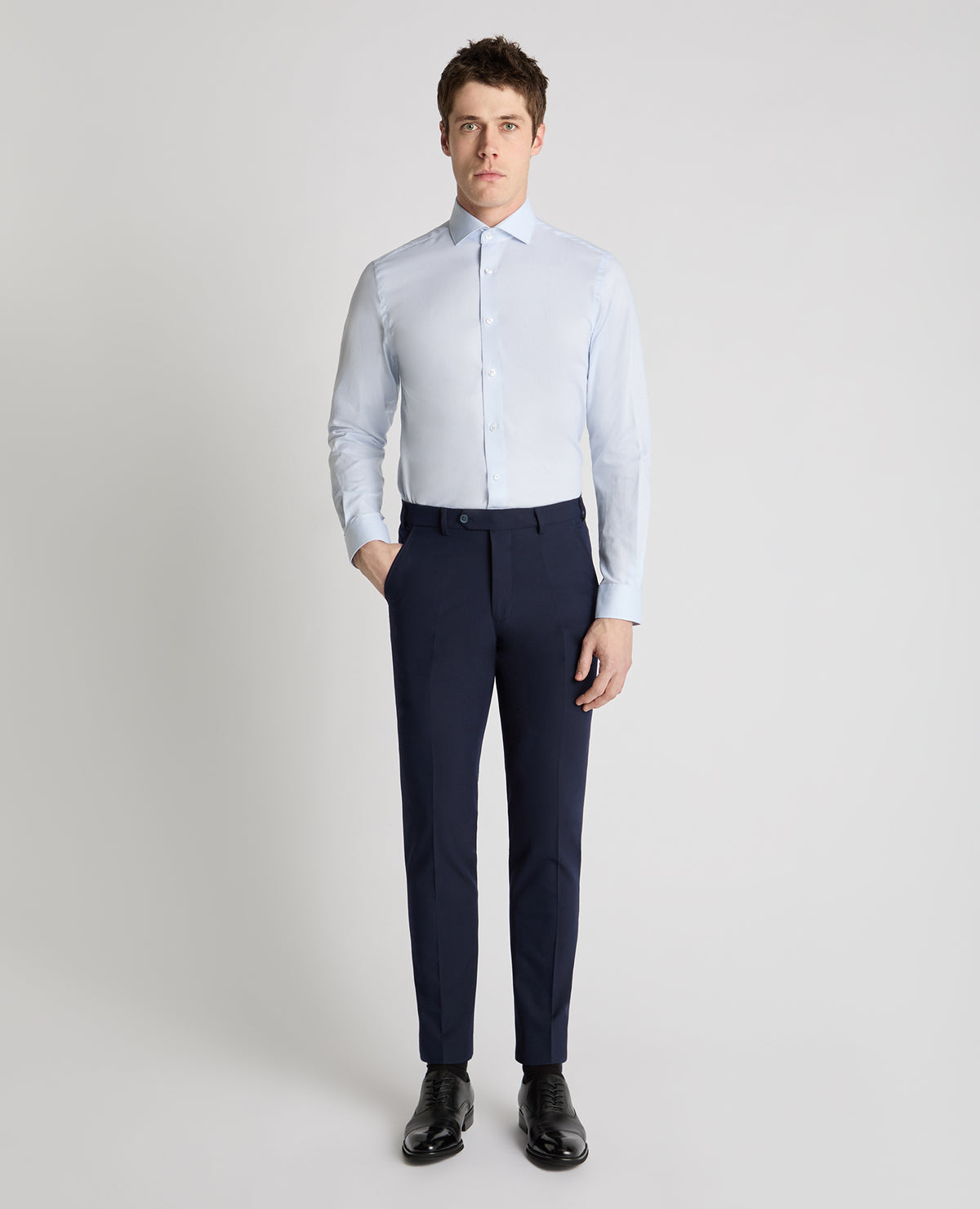 Man wearing a blue formal shirt