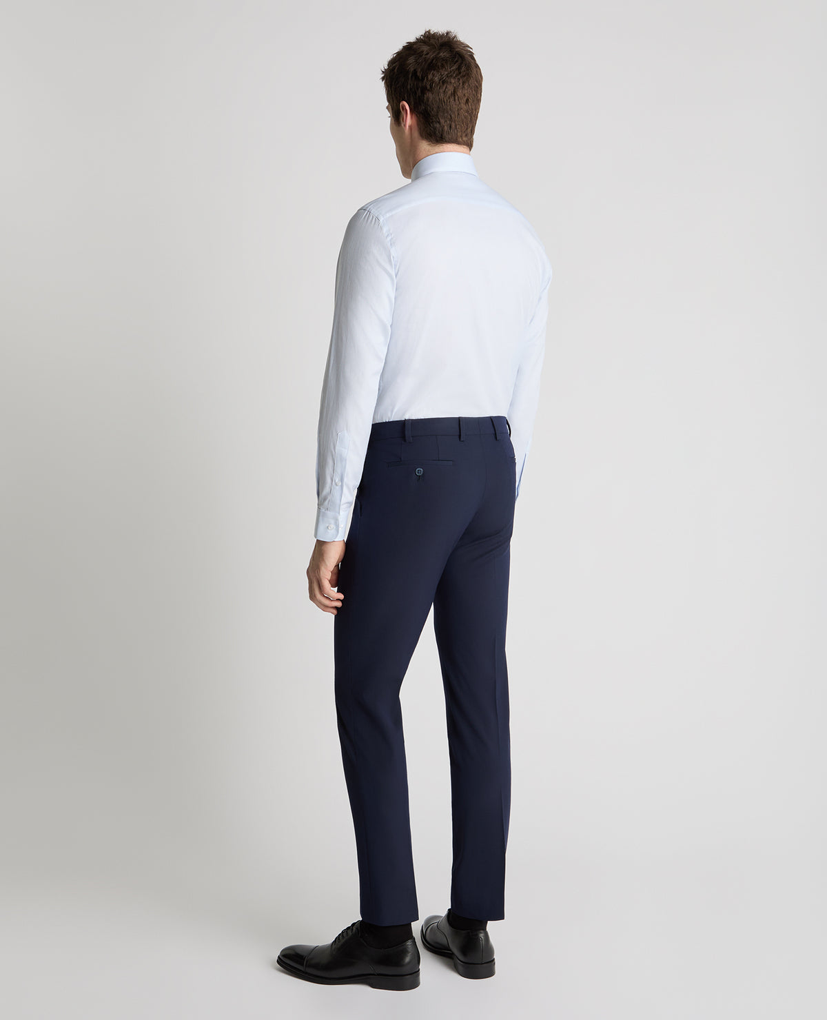 Man wearing a blue formal shirt