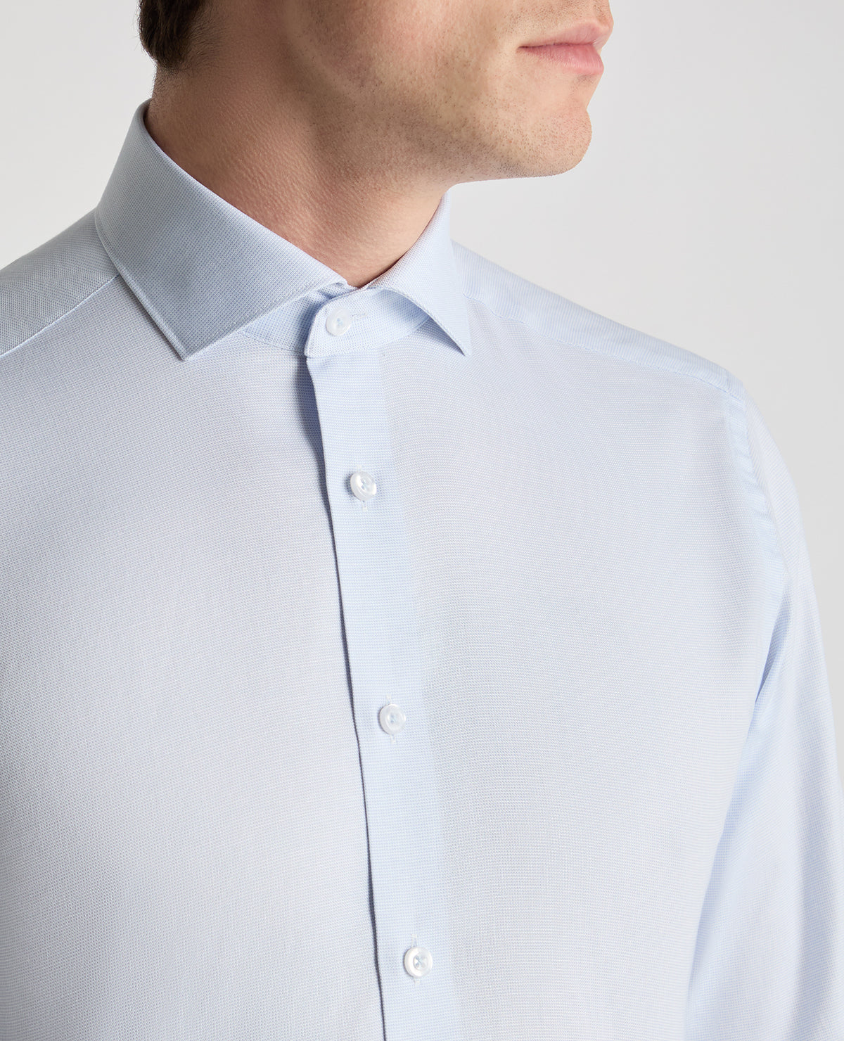 Man wearing a blue formal shirt