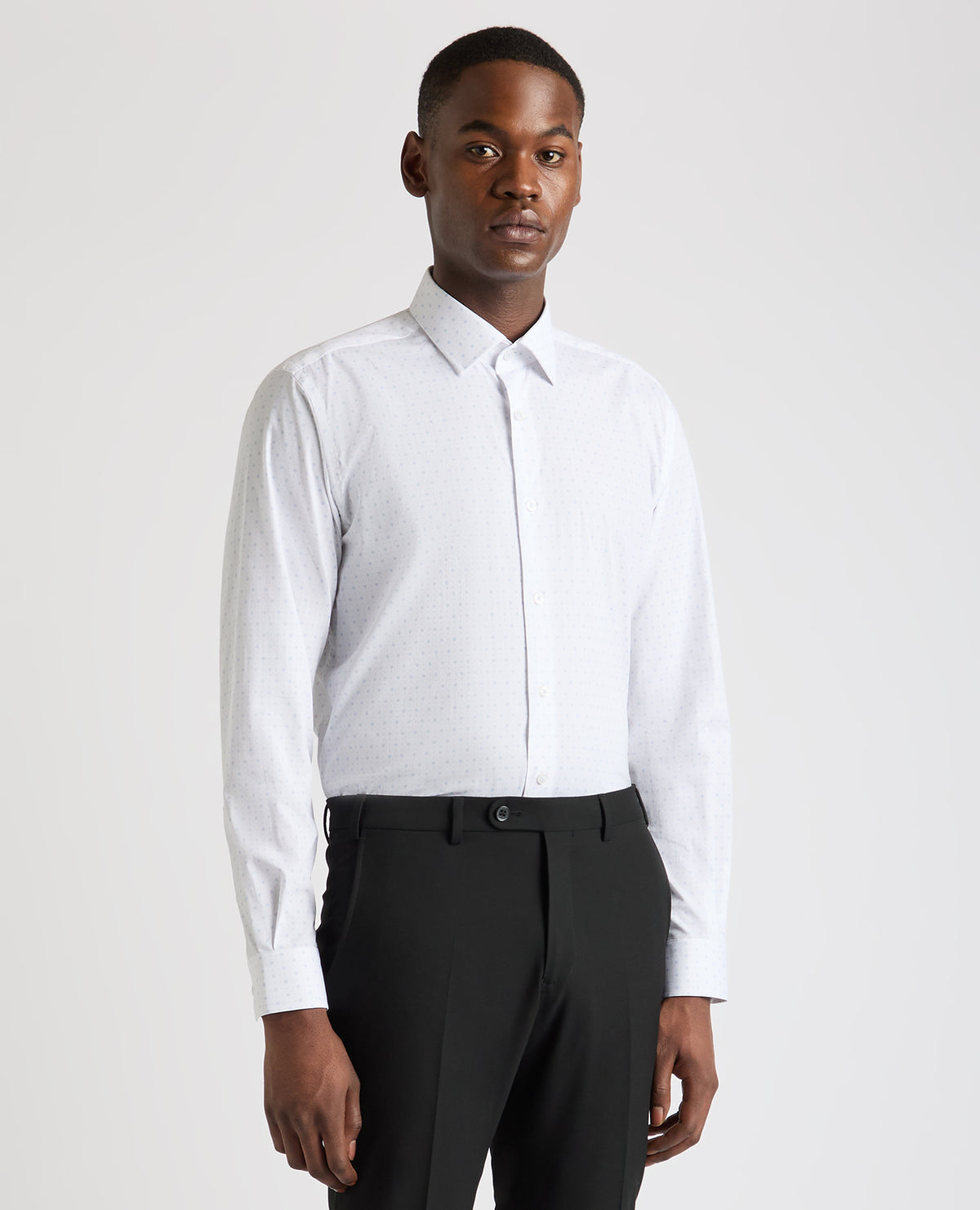 Man wearing a blue Tapered Fit Cotton Stretch Shirt