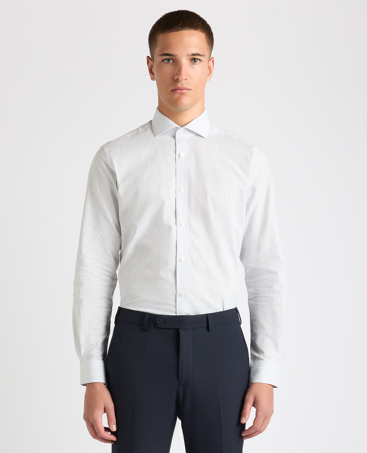 Man wearing a blue Tapered Fit Striped Cotton-Linen Shirt