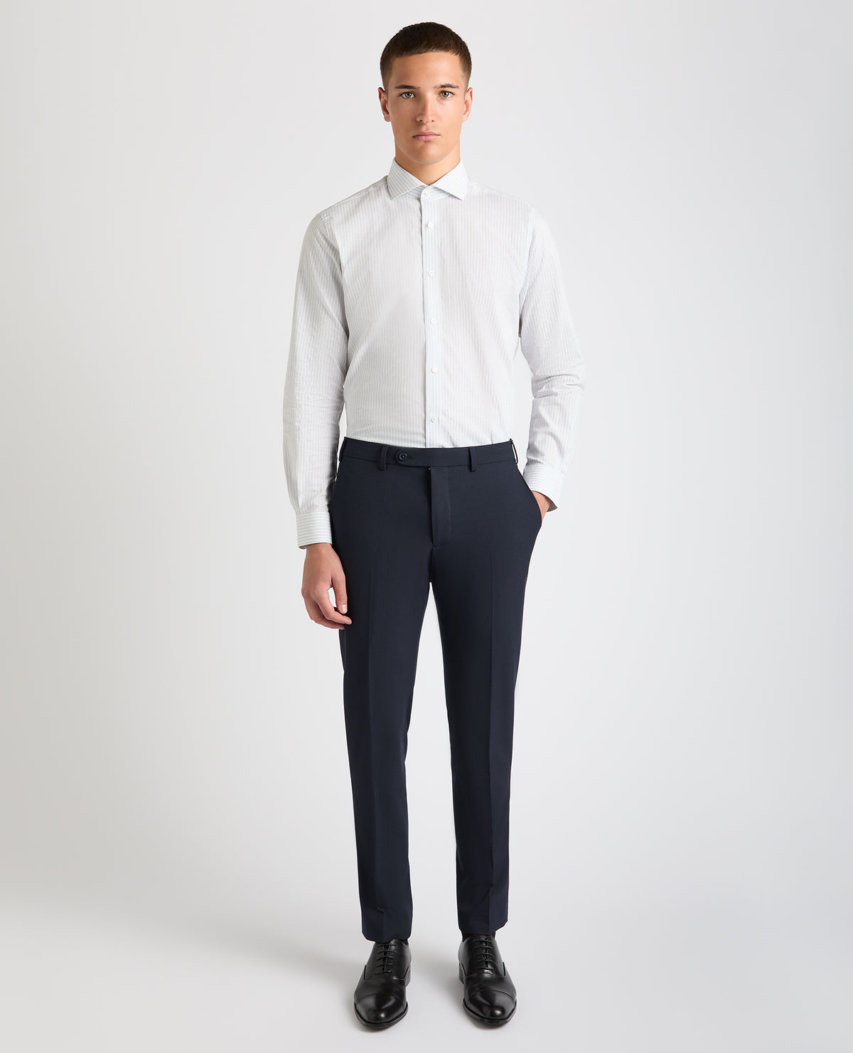 Man wearing a blue Tapered Fit Striped Cotton-Linen Shirt
