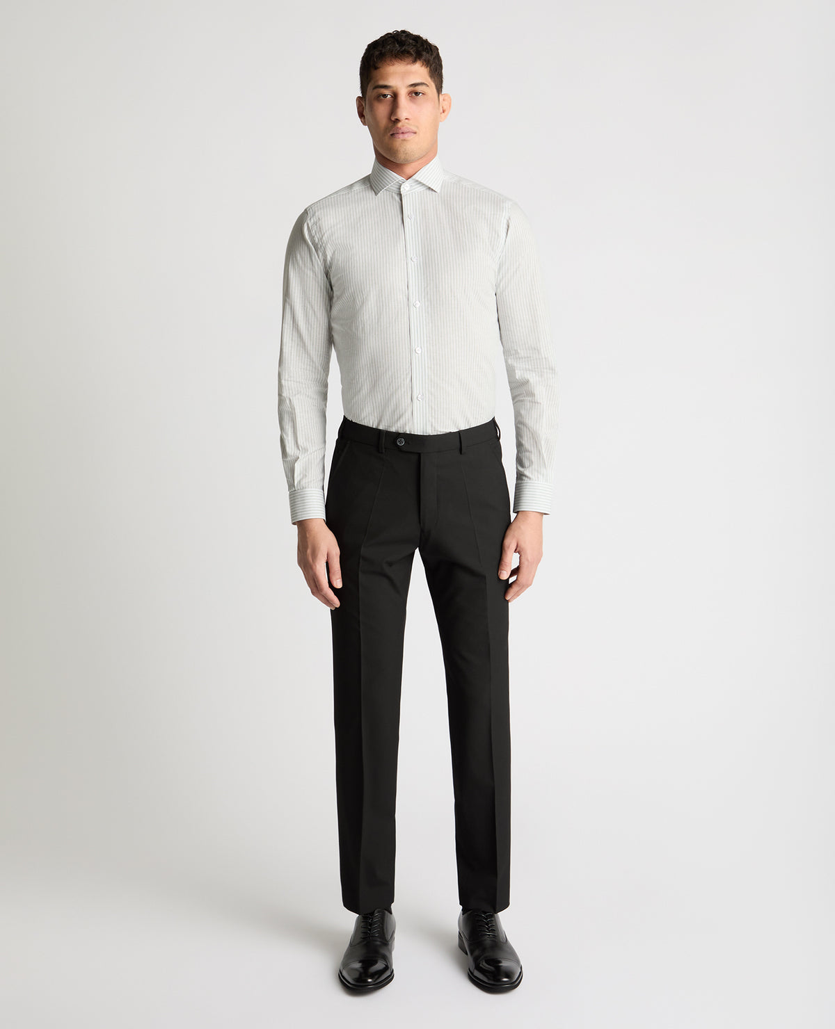 Man wearing a white and green formal shirt