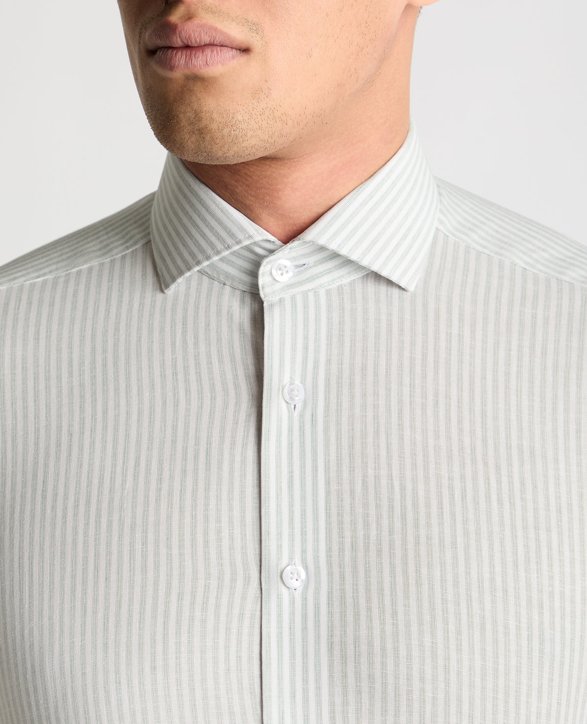Man wearing a white and green formal shirt