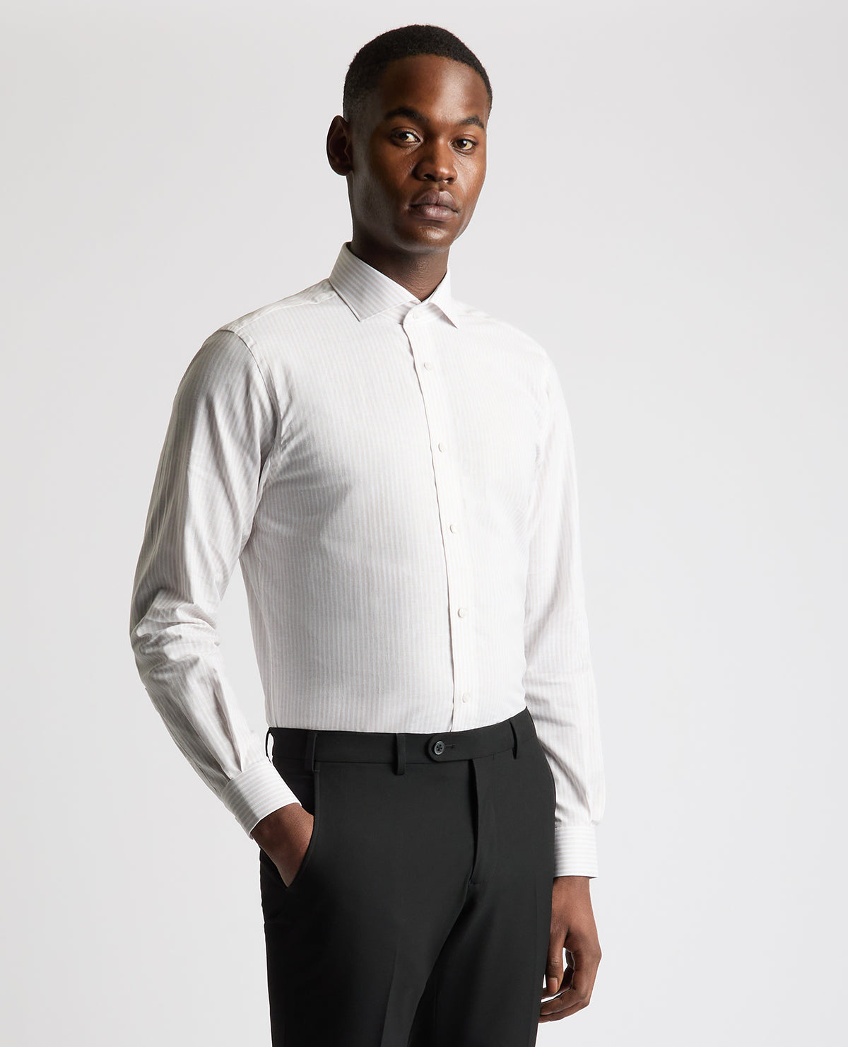 Man wearing a brown Tapered Fit Striped Cotton-Linen Shirt