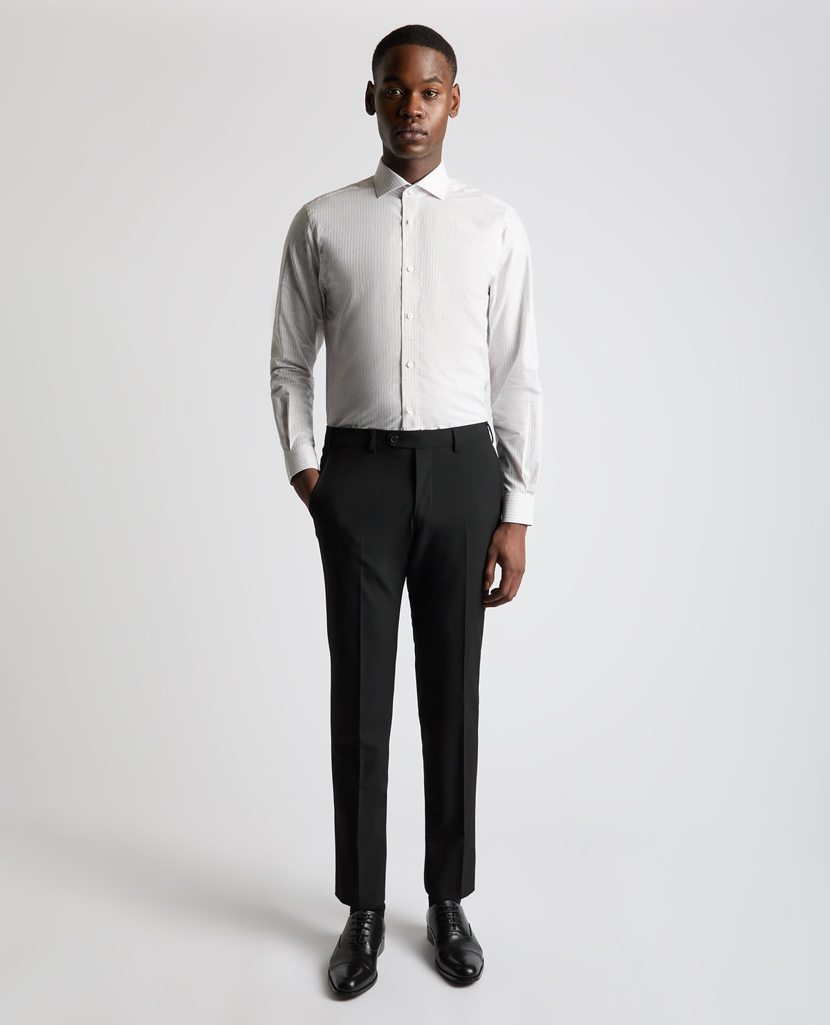 Man wearing a brown Tapered Fit Striped Cotton-Linen Shirt