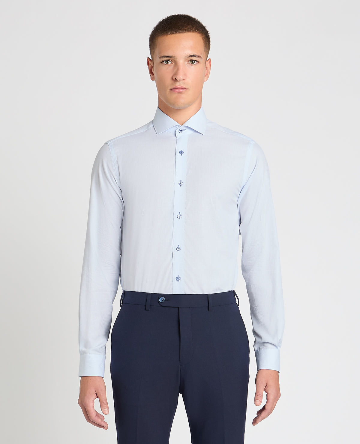 Man wearing a blue formal shirt