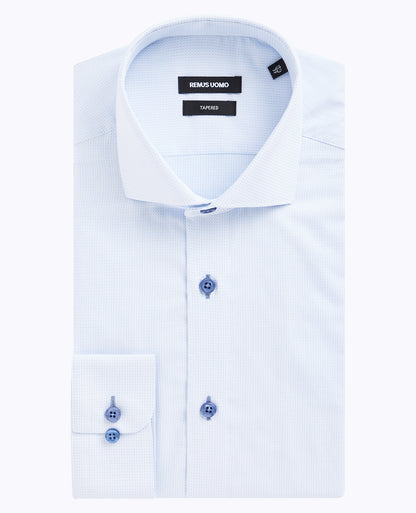 Man wearing a blue formal shirt