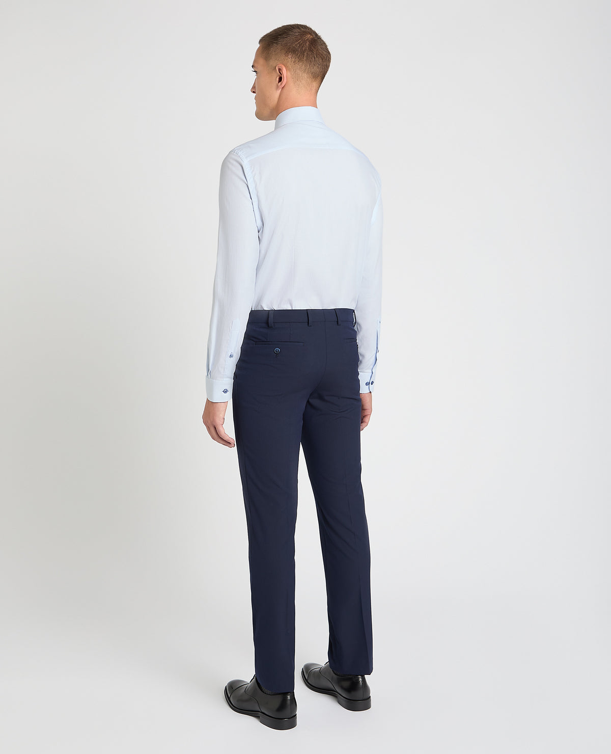 Man wearing a blue formal shirt