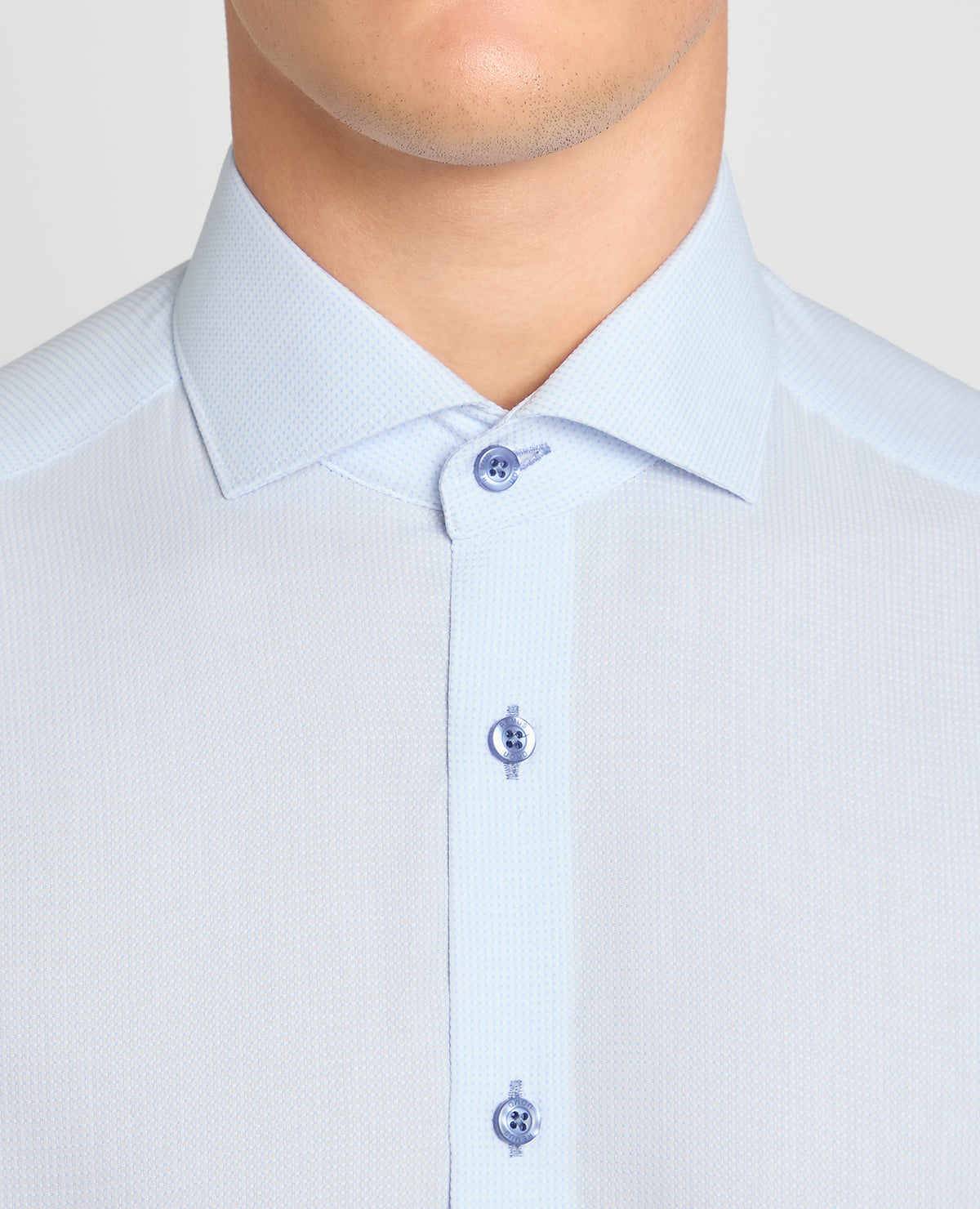 Man wearing a blue formal shirt