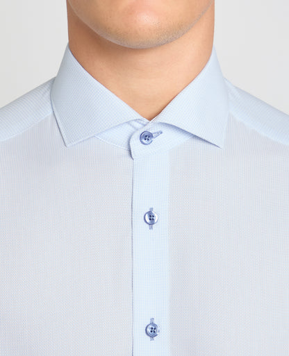 Man wearing a blue formal shirt