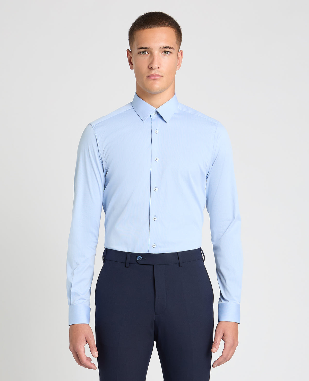 Man wearing a blue formal shirt