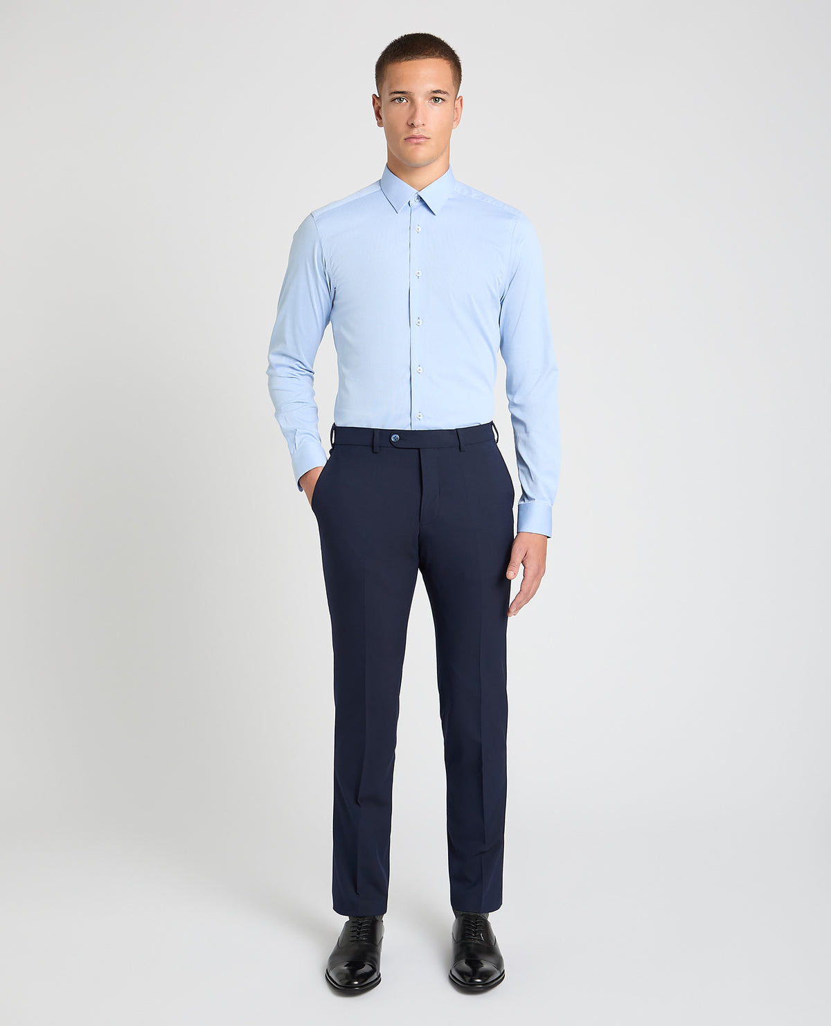 Man wearing a blue formal shirt