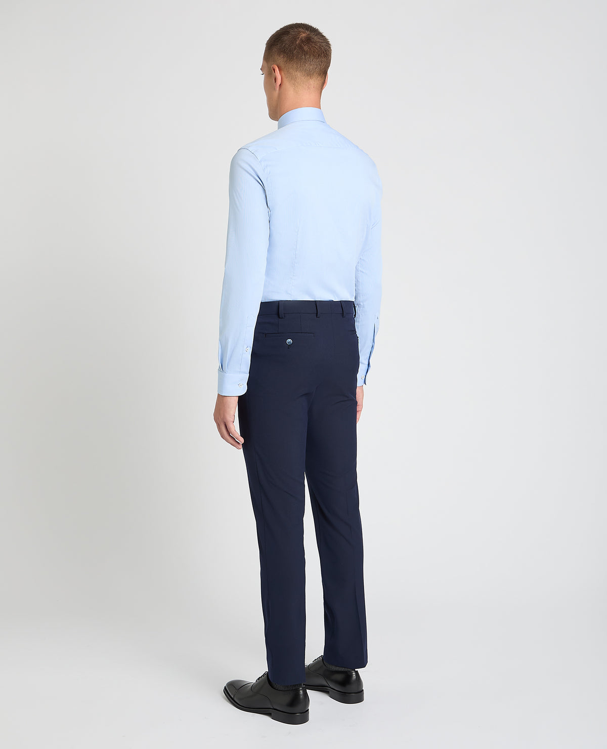 Man wearing a blue formal shirt